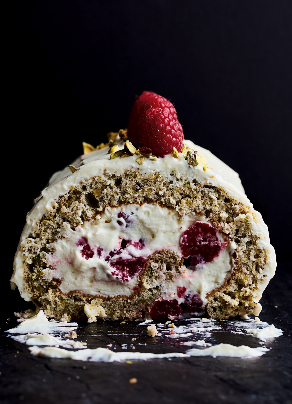 Image of Yotam Ottolenghi's Pistachio Roulade with Raspberries and White Chocolate