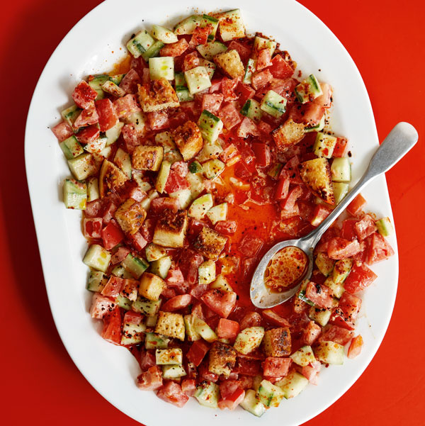 Image of Ixta Belfrage's Tomato Salad with Tahini Ginger Sauce, Chilli Oil and Crumpet Croutons